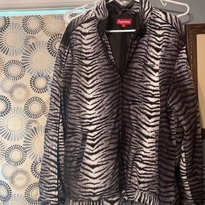 Supreme zip up zebra print jacket.